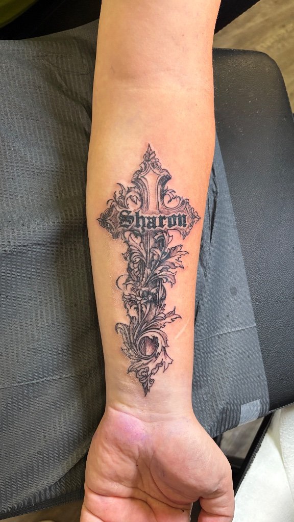 The gothic cross cover-up taking shape over the old Browning logo